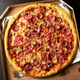 Illustration for article titled What if pizza boxes are the future of local news?